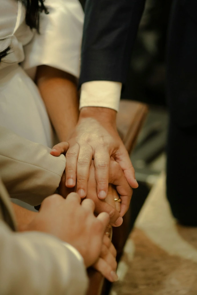 Hands clasped together in a moment of connection